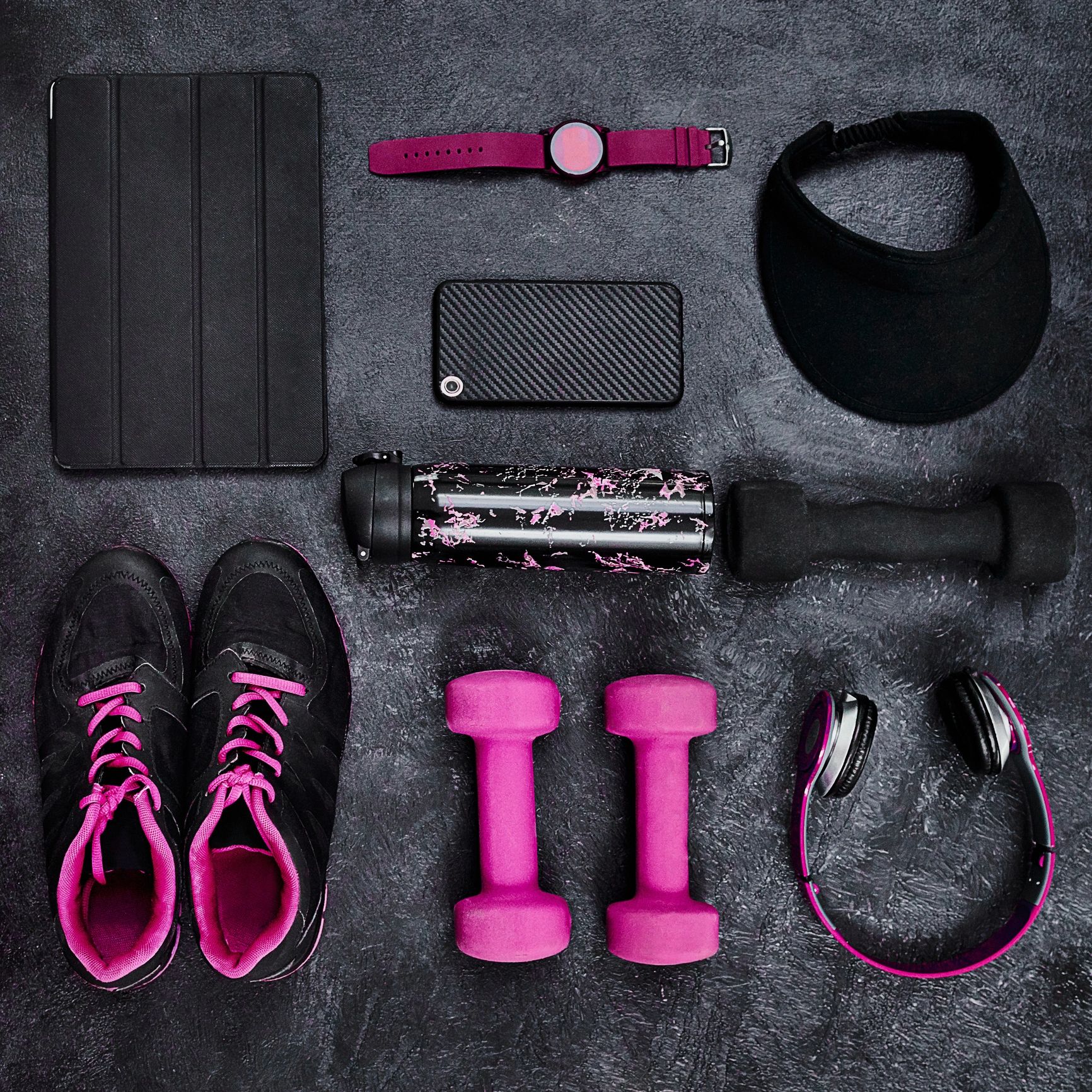 Sneaker cleaning kit on a clean studio background (brush, cleaner bottle, microfiber towel)