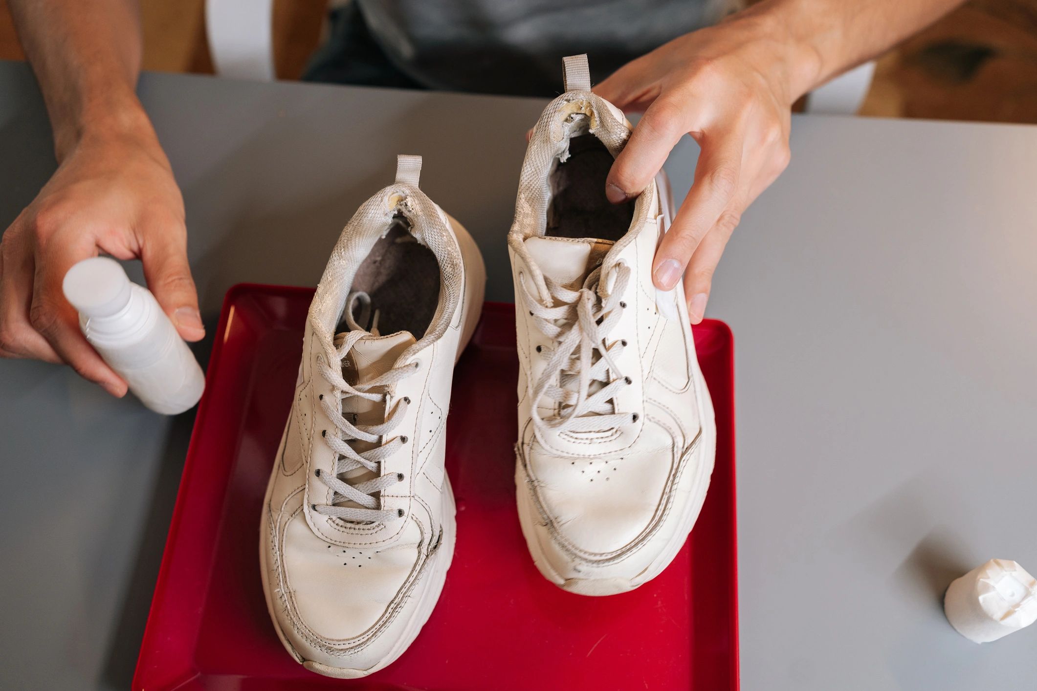 Sneaker cleaning and care with cleaner and white sneaker