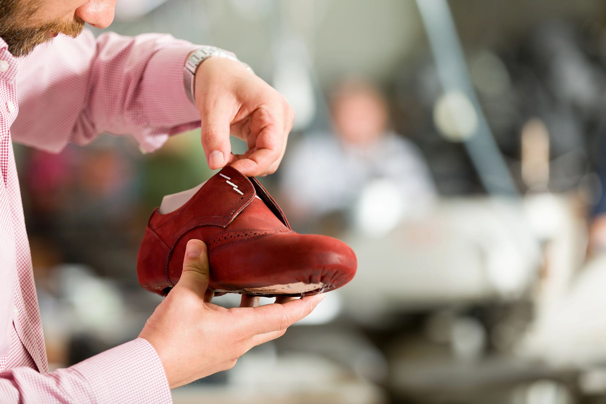 Shoe being examined in a factory setting