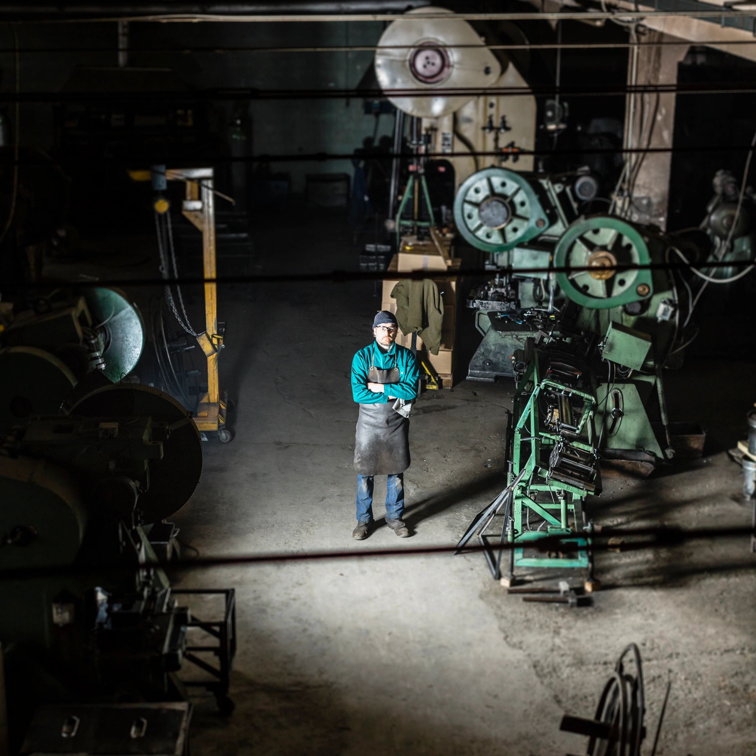 Worker portrait in a small factory