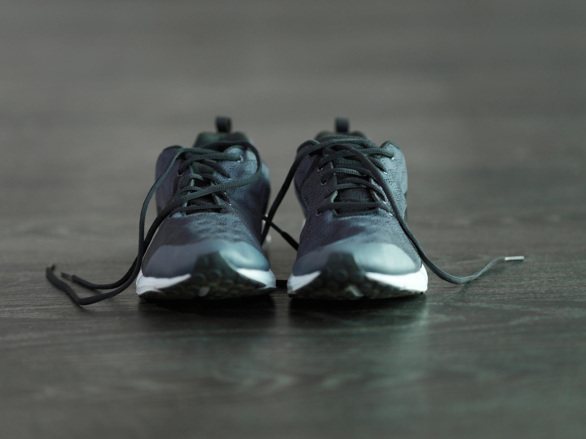 Athletic sneakers on a gym floor